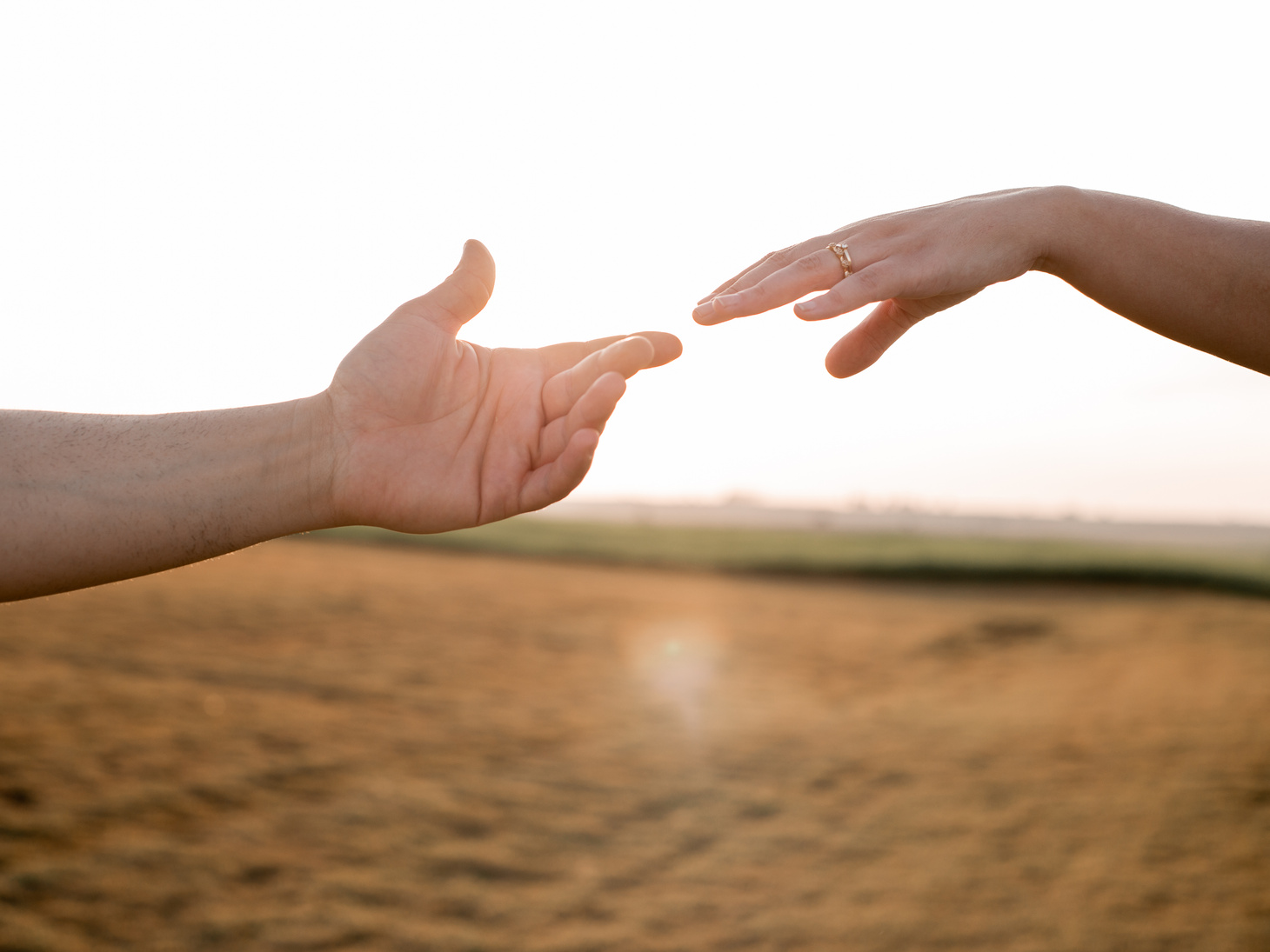 Hands Reaching Out to One Another